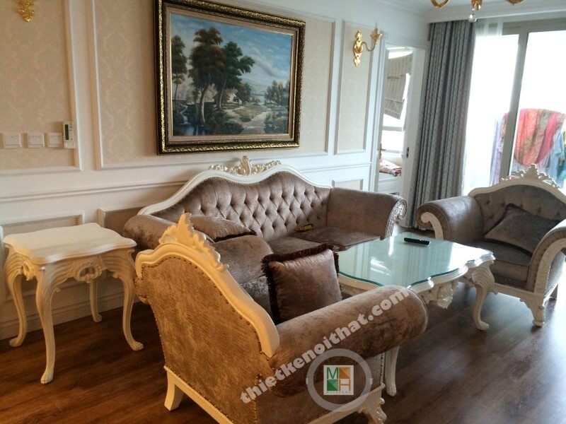 Không gian nội thất của phòng khách được bố trí với những thiết bị như sofa bộ, tranh, kệ trang trí, hệ tủ tivi và nhiều thứ khác.